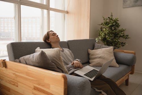 Free Photo Of Man Sleeping On Sofa Stock Photo