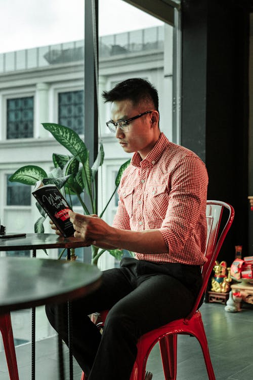 Free Photo Of Man Reading Book  Stock Photo