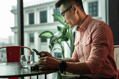 Free Photo Of Man Using Mobile Phone  Stock Photo