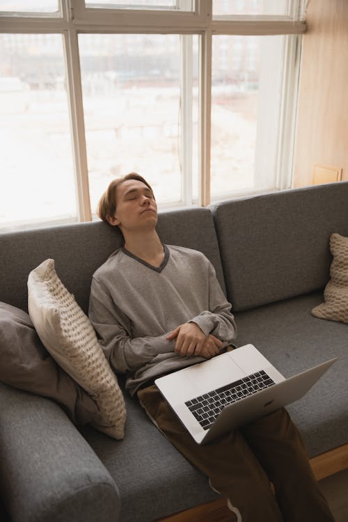 Photo Of Man Sleeping On Couch 