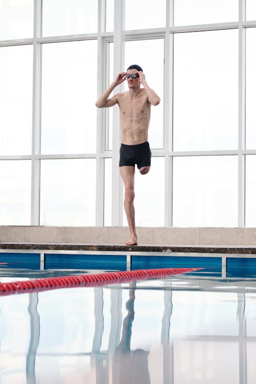 Man Standing Beside Swimming Pool