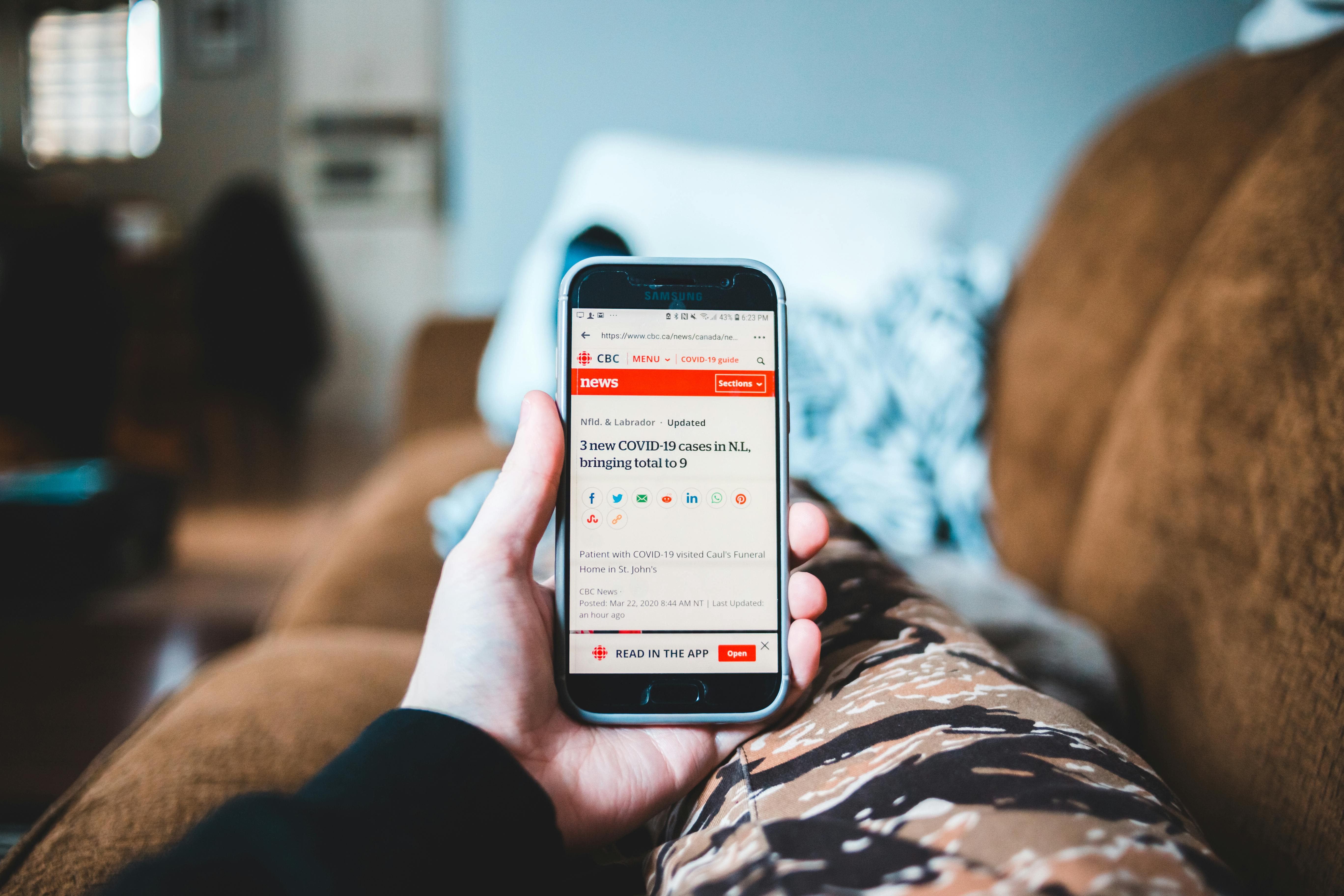 person setting up news alerts on phone - Hollywood Gossip