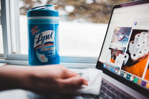 Photo Of Person Cleaning Laptop