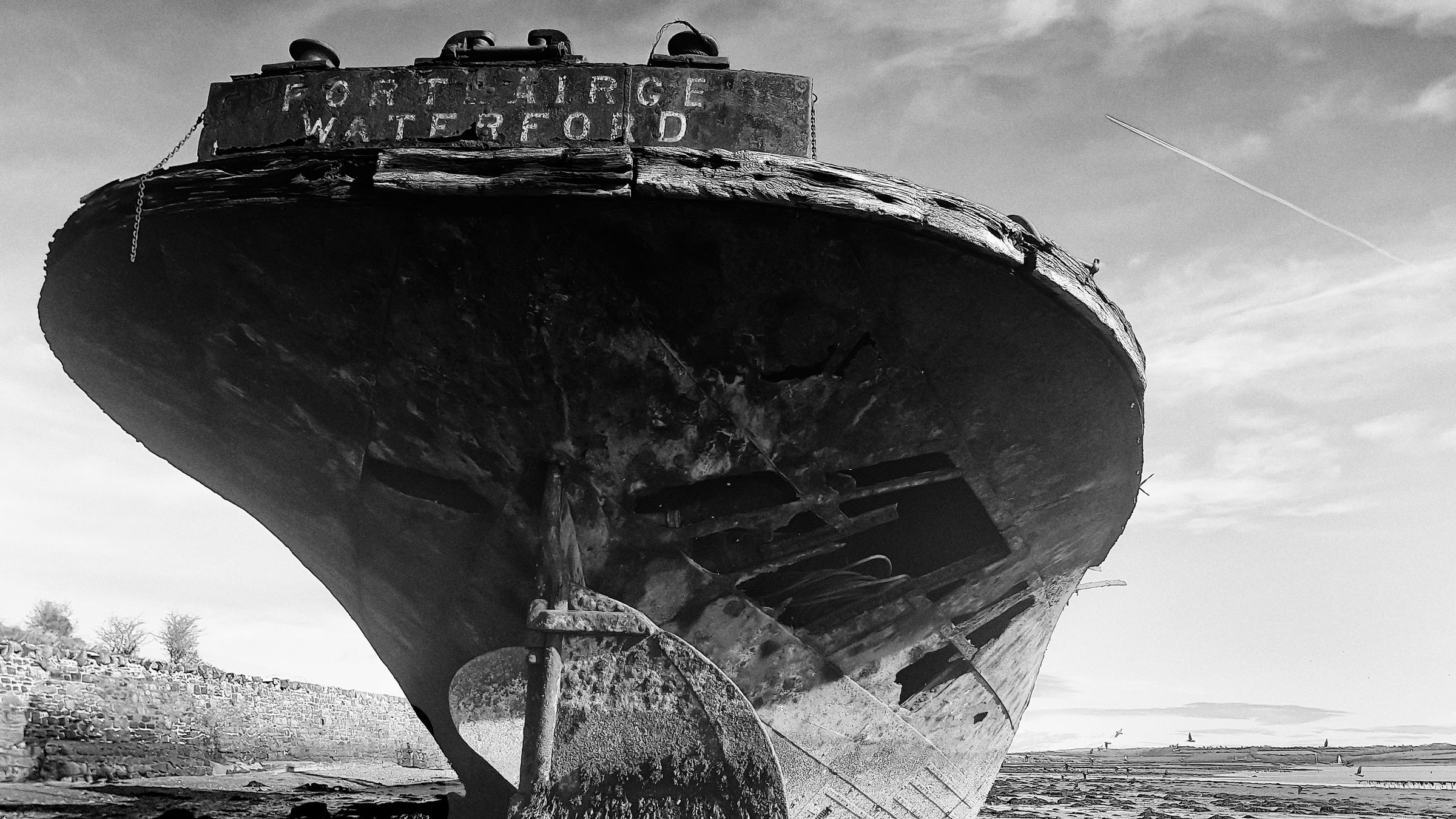 Monochrome image of an abandoned shipwreck at Wexford Harbor, Ireland