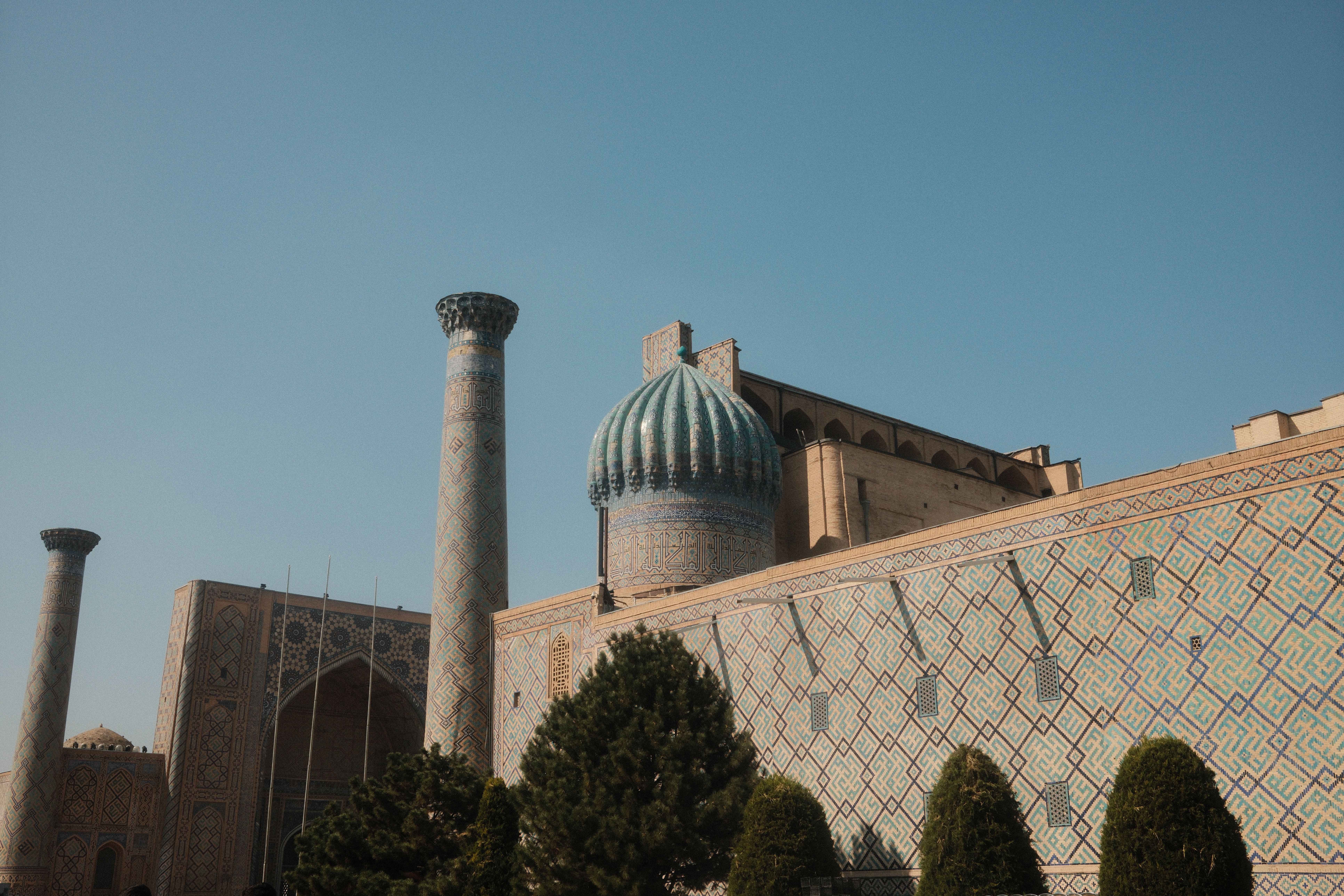 Stunning view of Gur-e-Amir Mausoleum's intricate architecture under a clear sky.