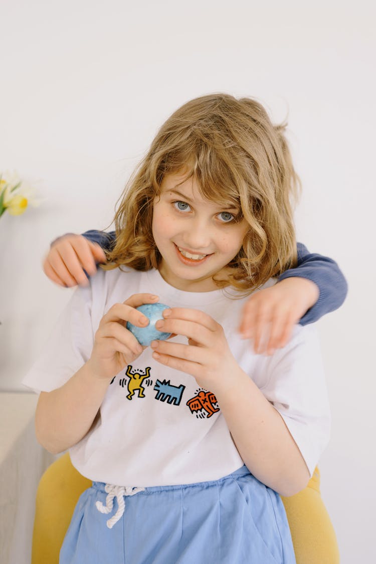 Little Girl Holding An Easter Egg