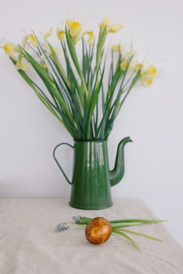 Easter Egg And Flowers On A Table