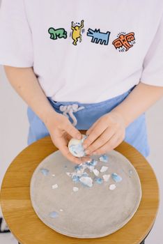 Child Peeling an Easter Egg
