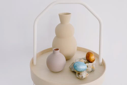 Vases and Easter Eggs on a Small Table