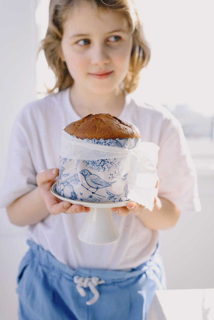 Happy Girl With Easter Cake At Home