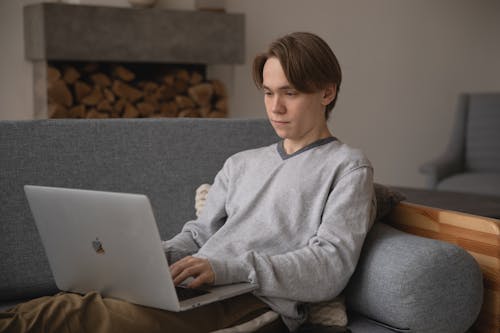 Photo Of Man Wearing Grey Sweater 