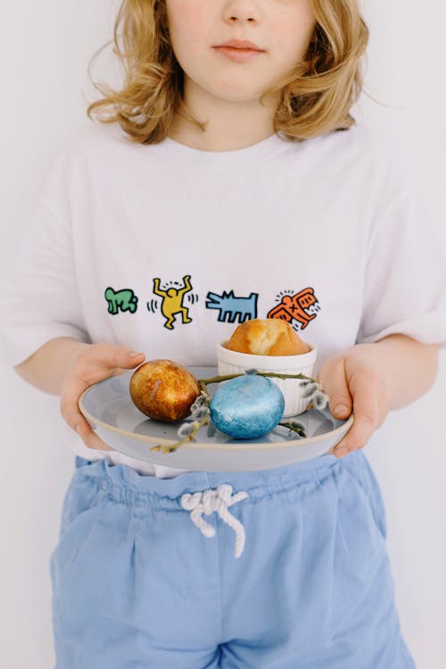 Little Girl Holding a Ceramic Plate