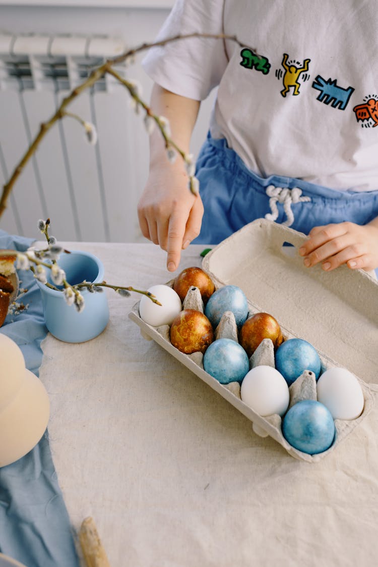 Child Pointing At An Egg