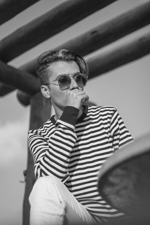 Monochrome Photo of Man Wearing Sunglasses