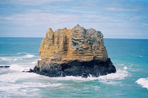 Photo Of Rock Formation on Sea