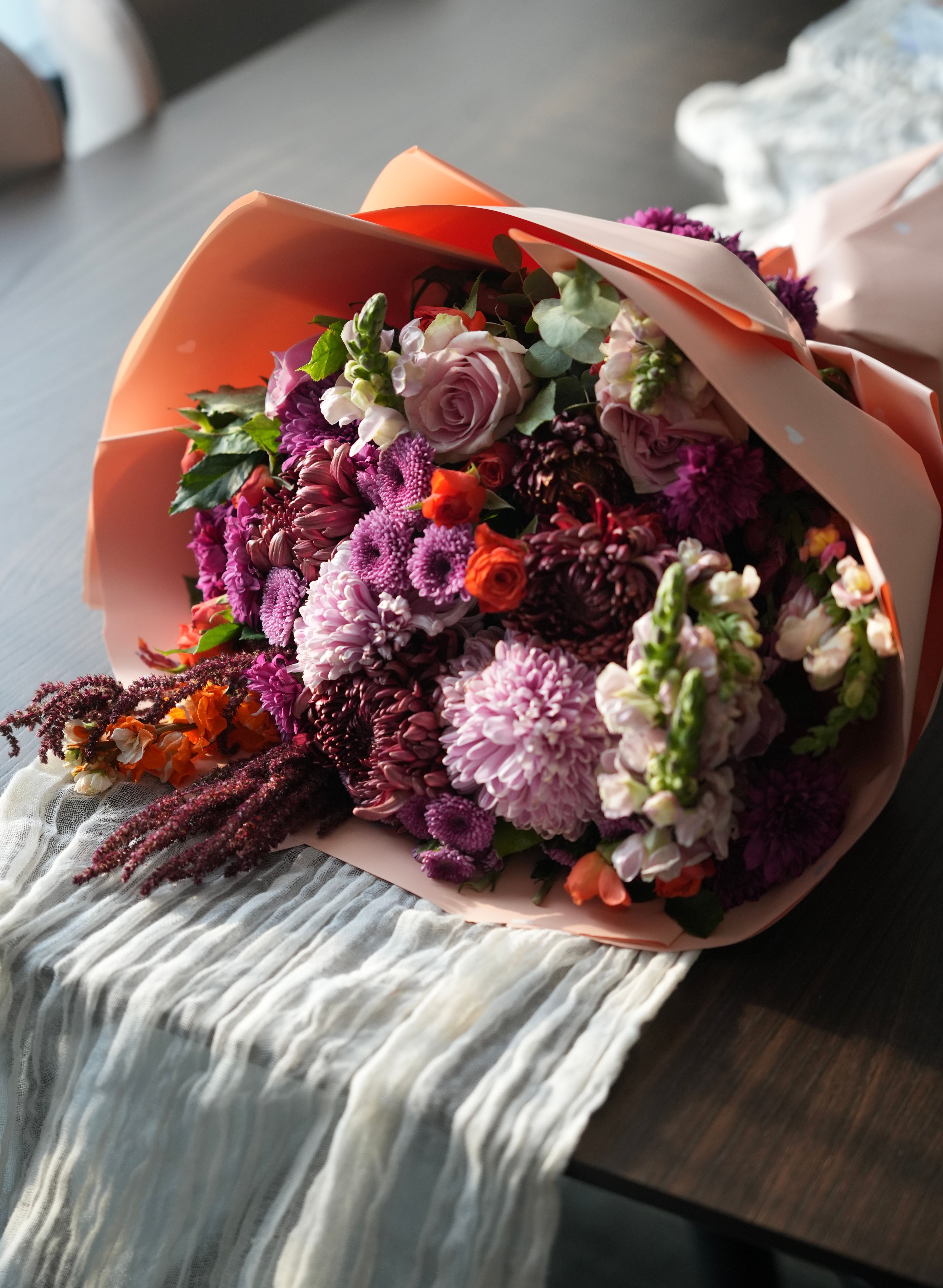 Elegant Floral Bouquet on Wooden Table · Free Stock Photo