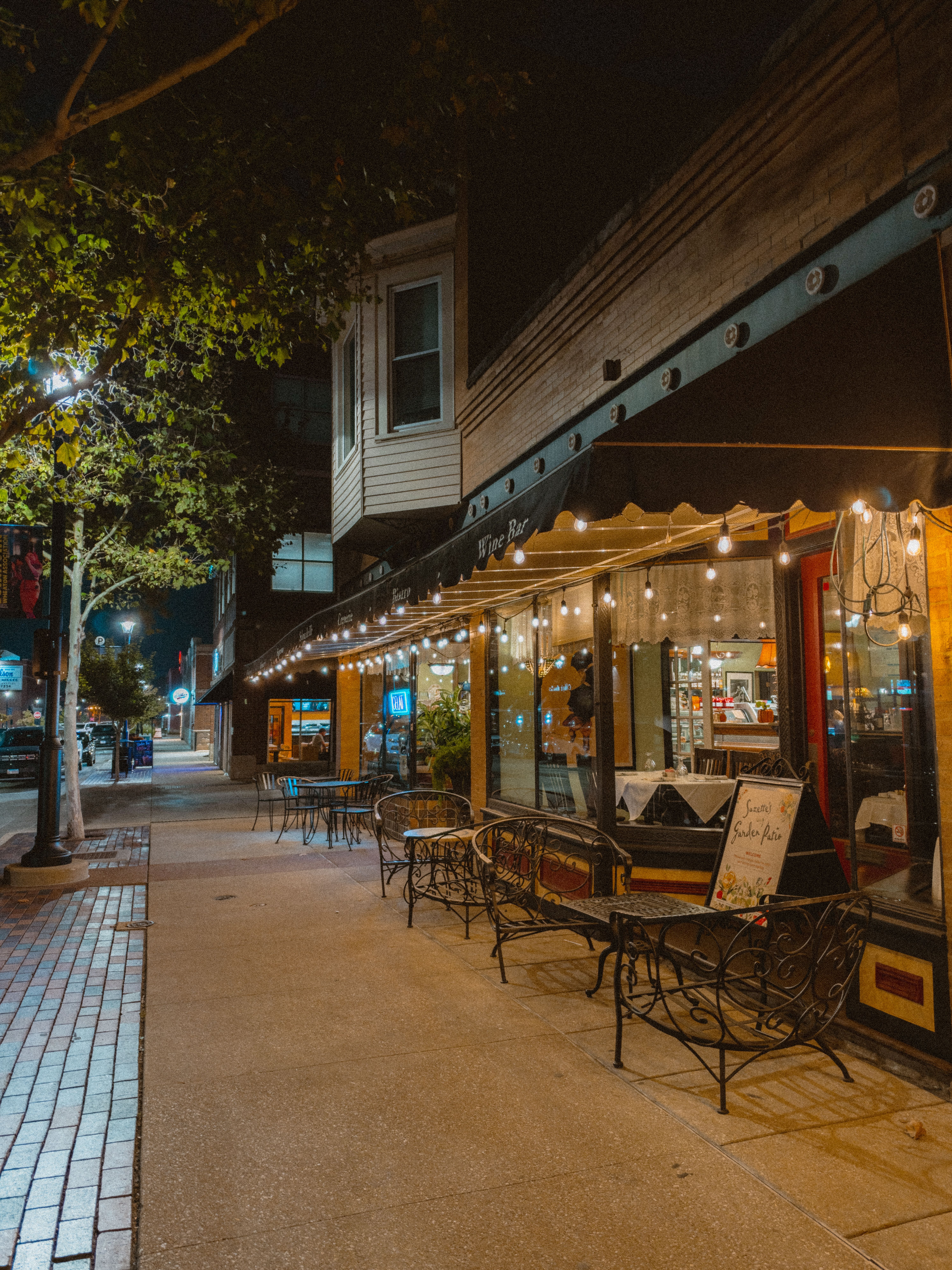 Cozy Night Street Cafe with String Lights · Free Stock Photo