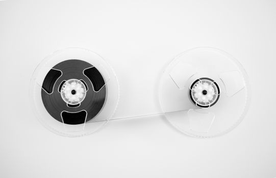 A classic audio reel tape on a minimalist white background. Perfect for retro or music-themed projects.