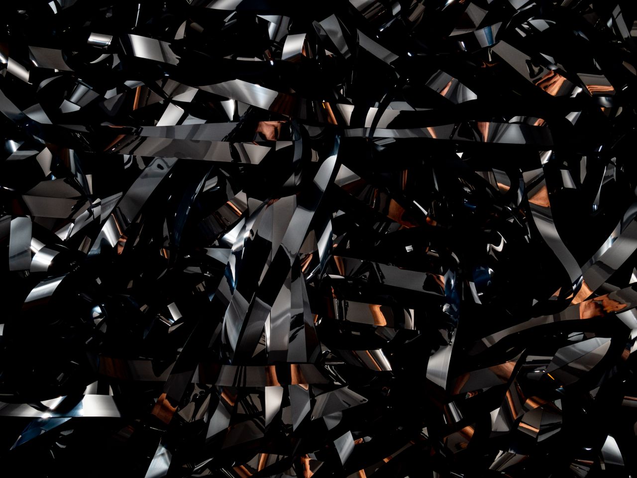 an abstract pattern of metallic and reflective surfaces creating a dyn