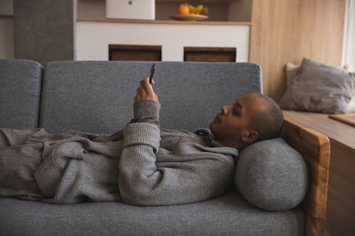 Photo Of Man Using His Mobile Phone