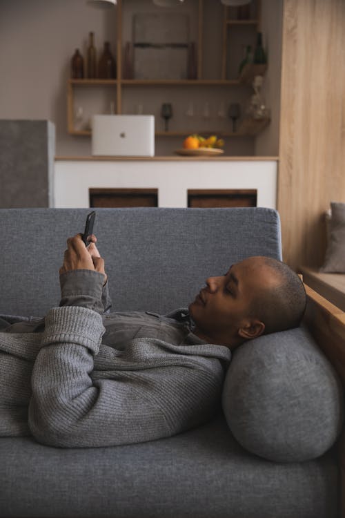 Photo Of Man Using His Mobile Phone