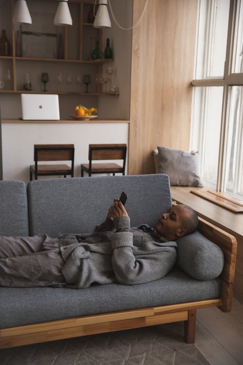 Photo Of Man Laying On Couch