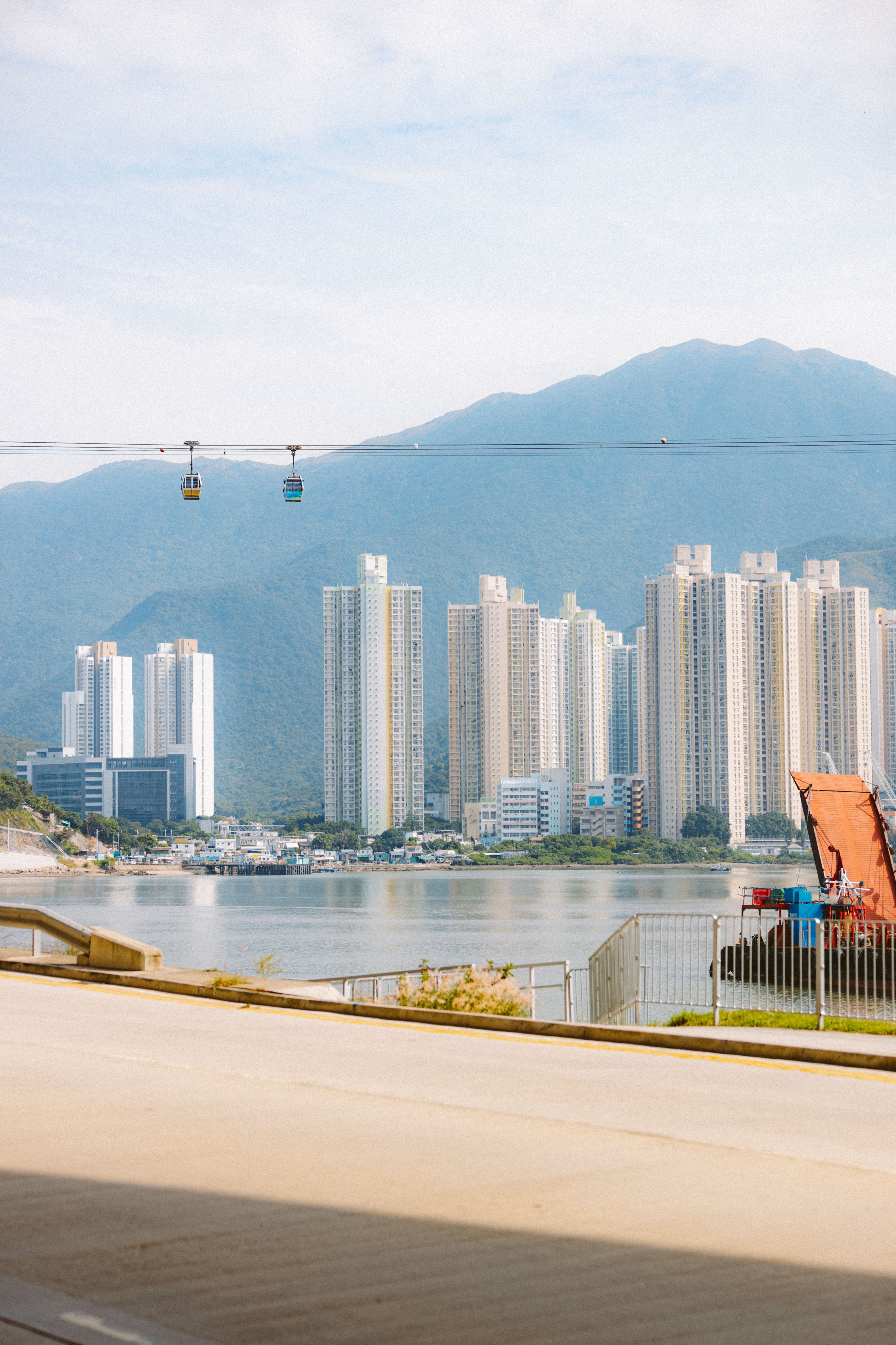 Modern City Skyline Overlooking Tranquil Water · Free Stock Photo