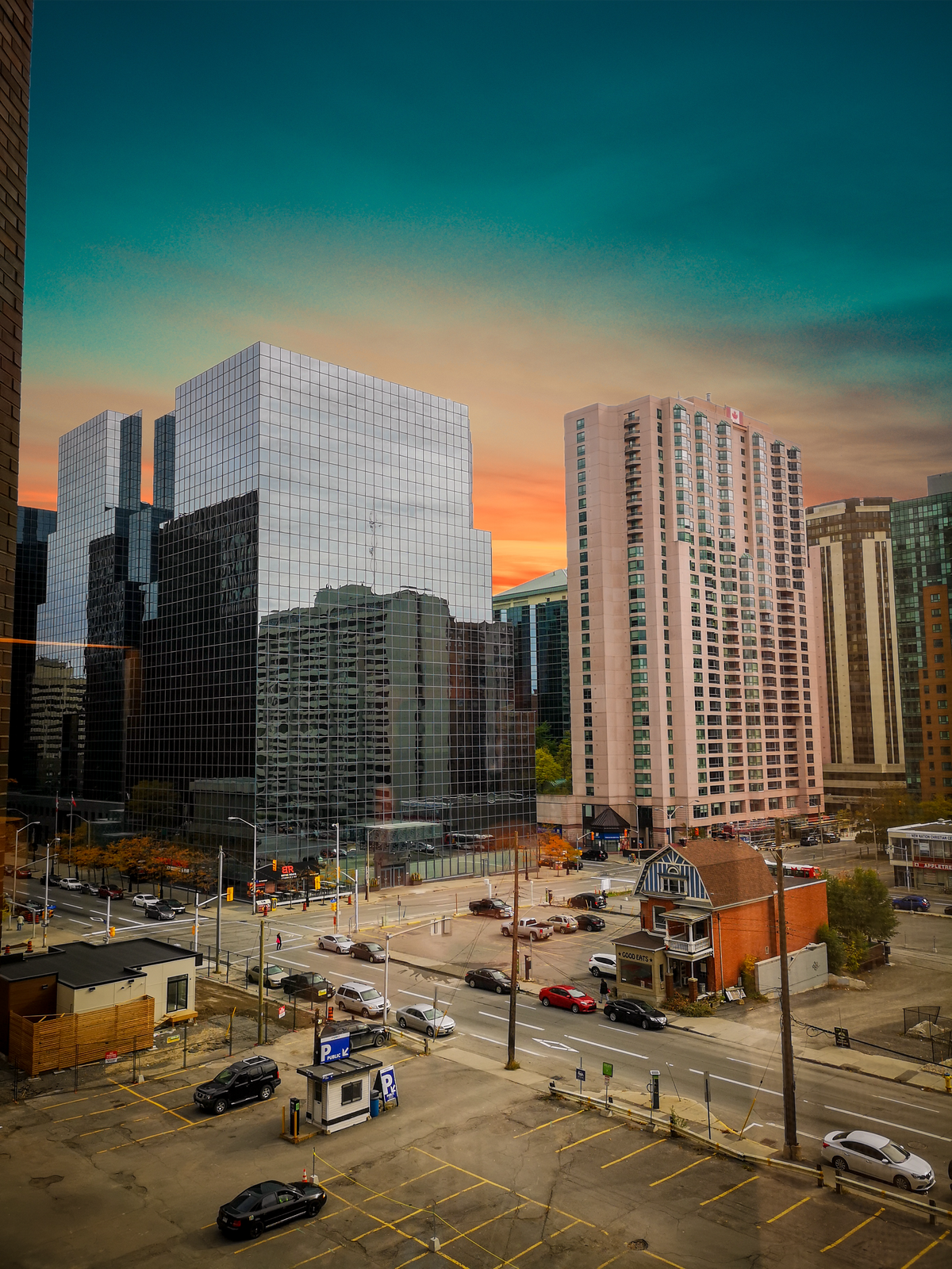A modern glass office building exterior at dusk