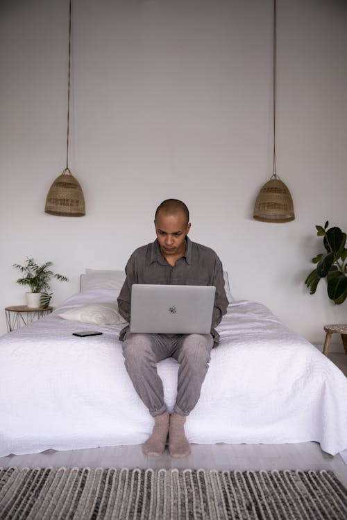 Free Photo Of Man Using Laptop Stock Photo