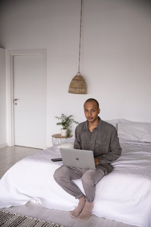 Free Photo Of Man Using Laptop Stock Photo