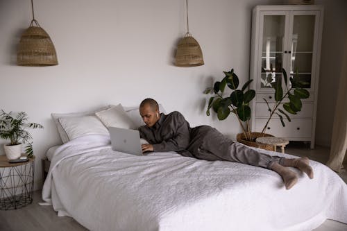 Photo Of Man Laying On Bed