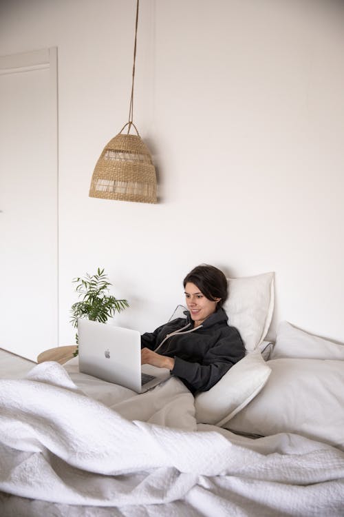 Free Photo Of Woman Laying On Bed Stock Photo