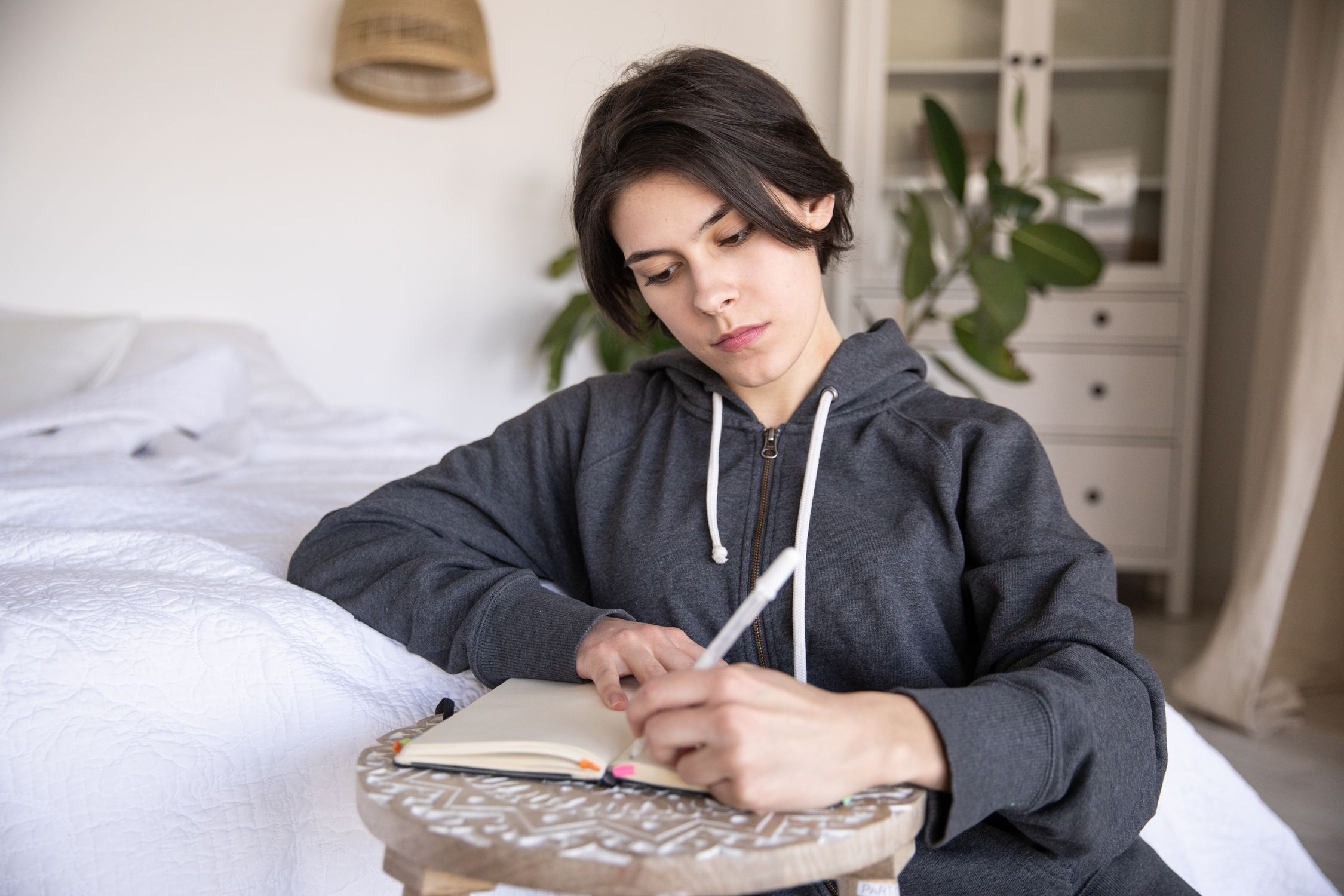 Woman Writing Photo Of Woman Writing On A Notebook · Free Stock Photo