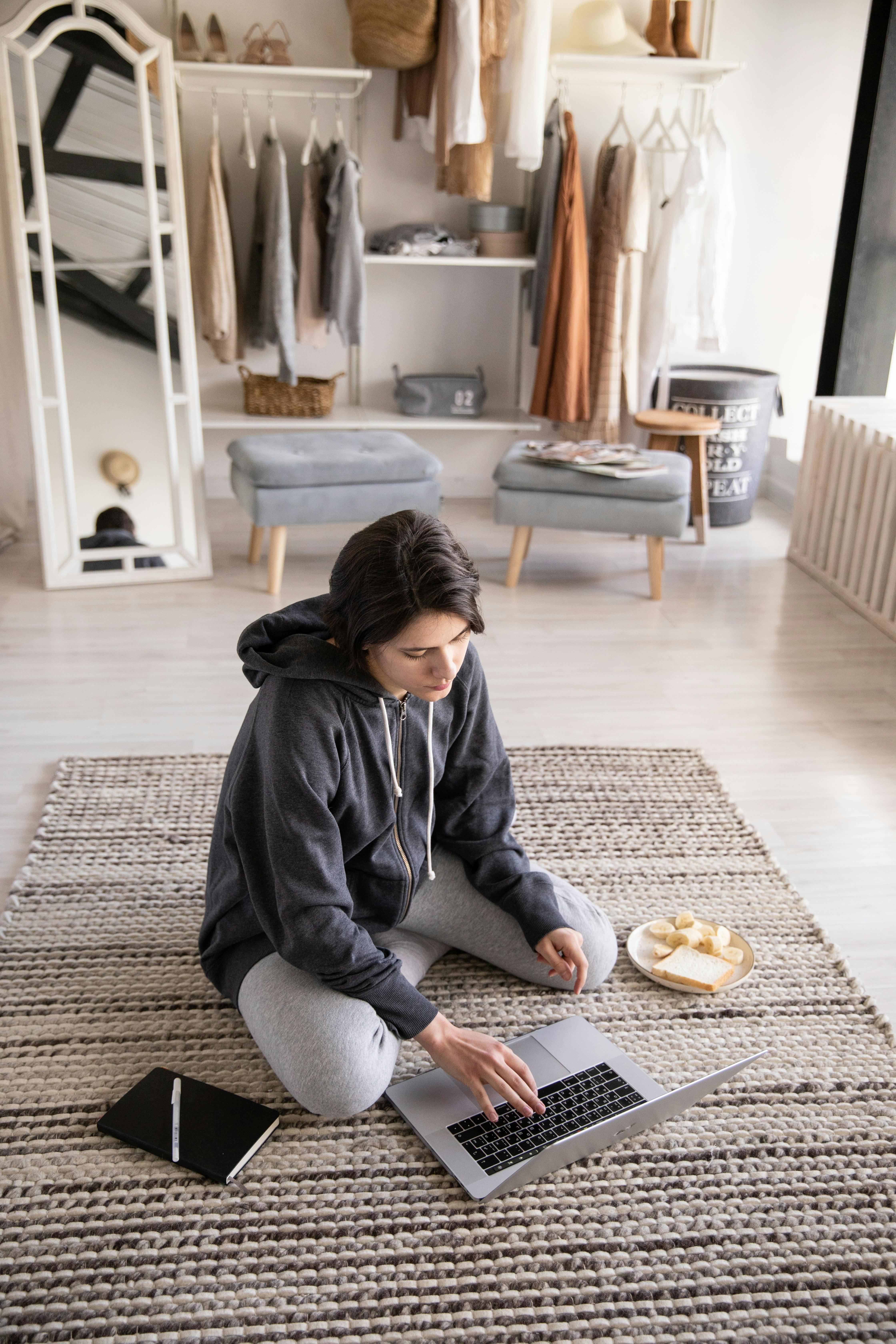 focused young lady working remotely at home