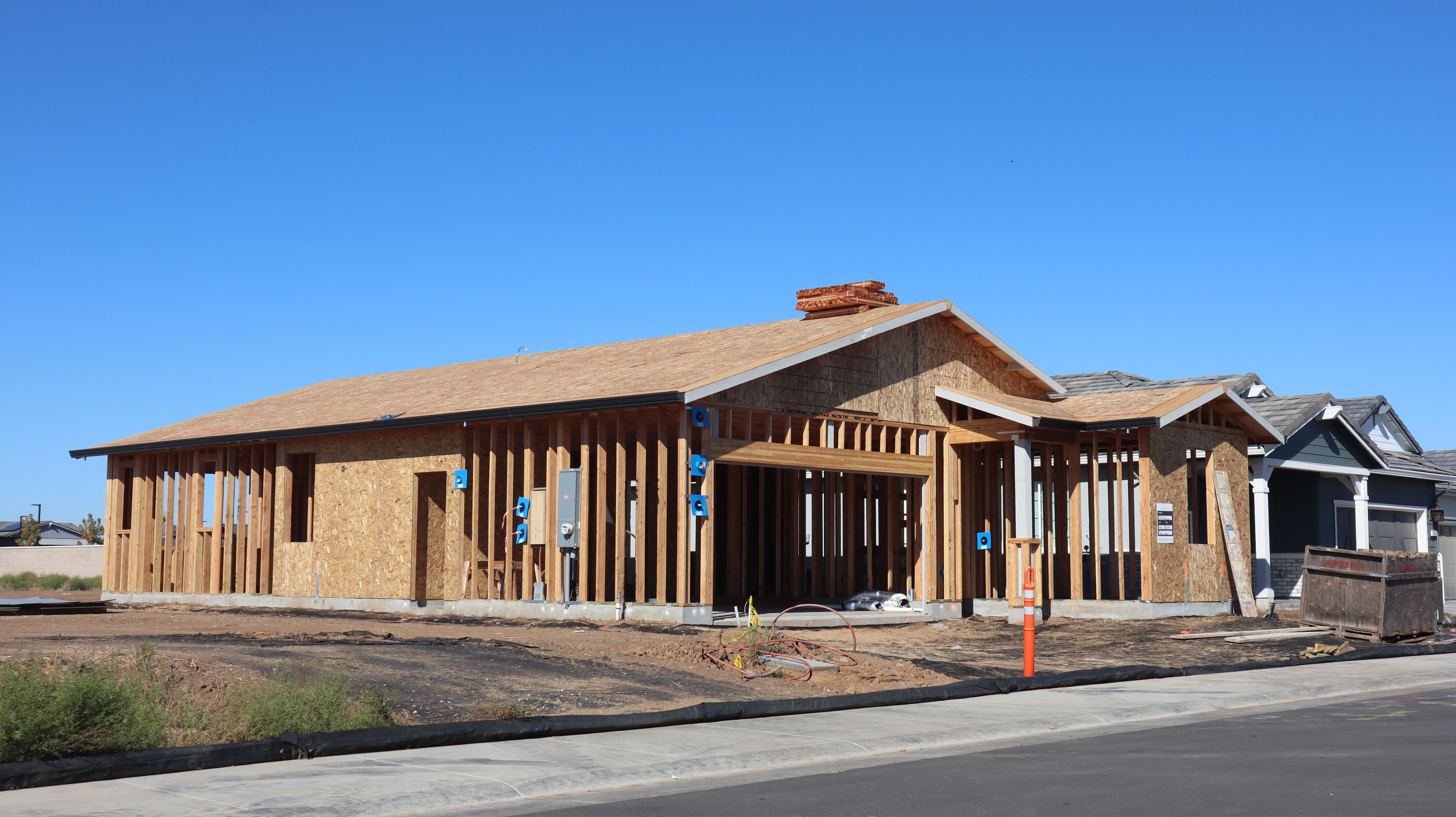 New House Construction Under Clear Blue Sky · Free Stock Photo
