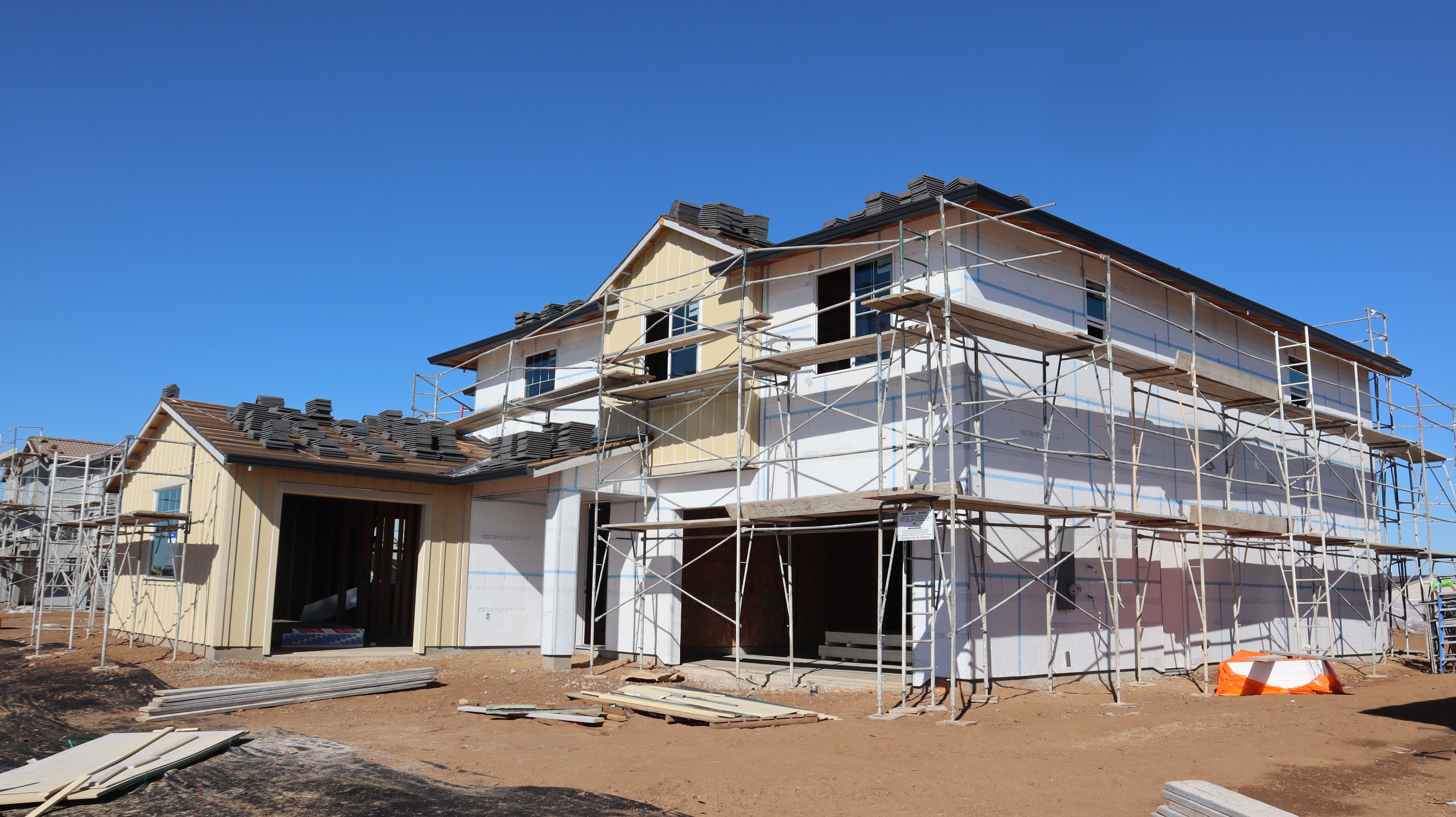 New house under construction with scaffolding · Free Stock Photo