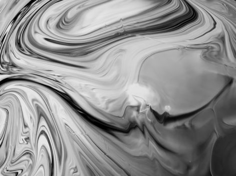 Flowing black and white marble texture creates a mesmerizing abstract art pattern.