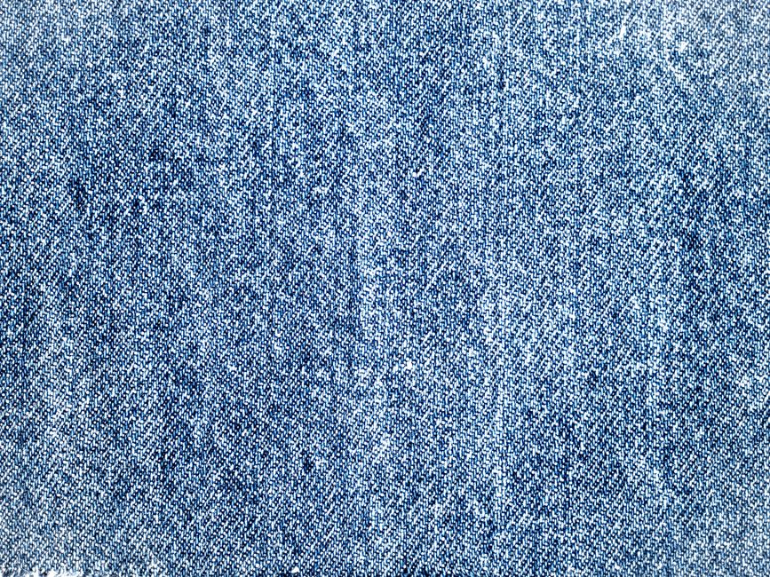 Detailed texture of blue denim fabric, perfect for use in design backgrounds and textile projects.