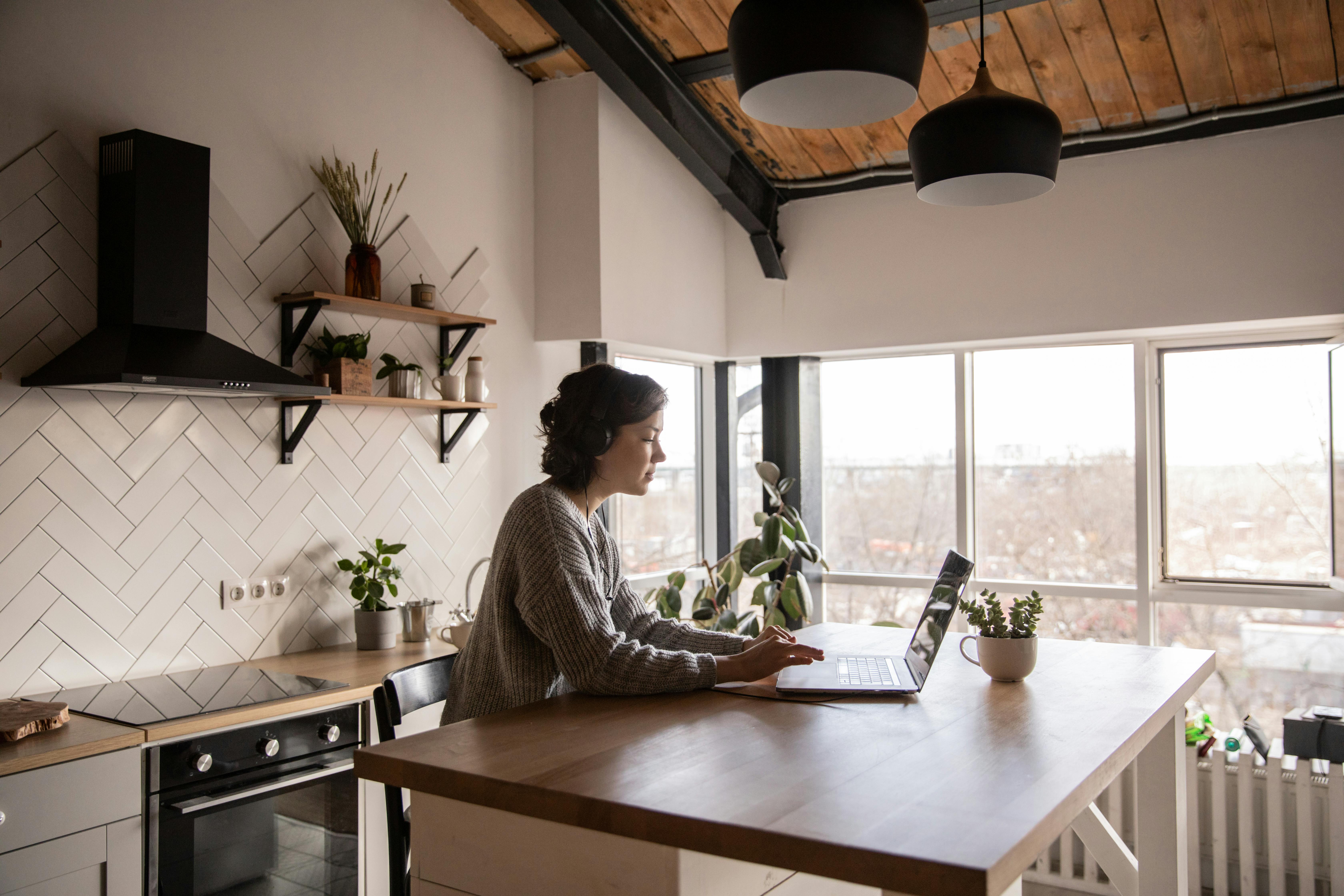 Woman working on a laptop in a multifunctional space