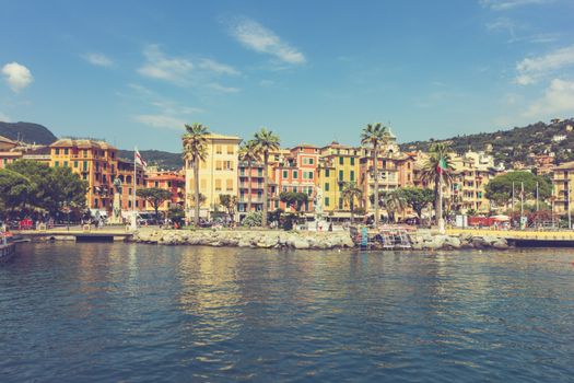 Beautiful view of Santa Margherita Ligure's colorful buildings by the waterfront, under a clear blue sky.