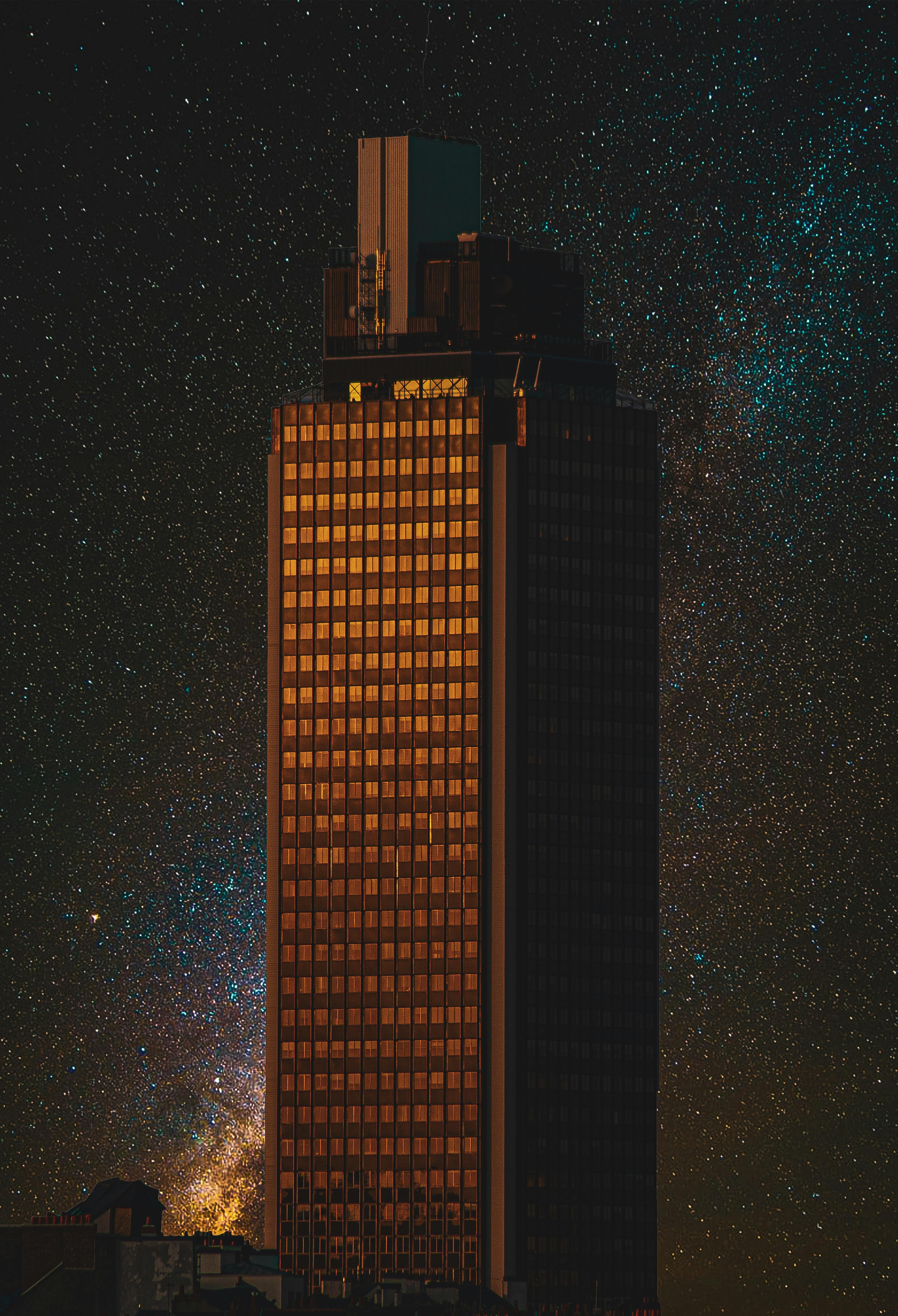 A High-Rise Building during Night Time · Free Stock Photo