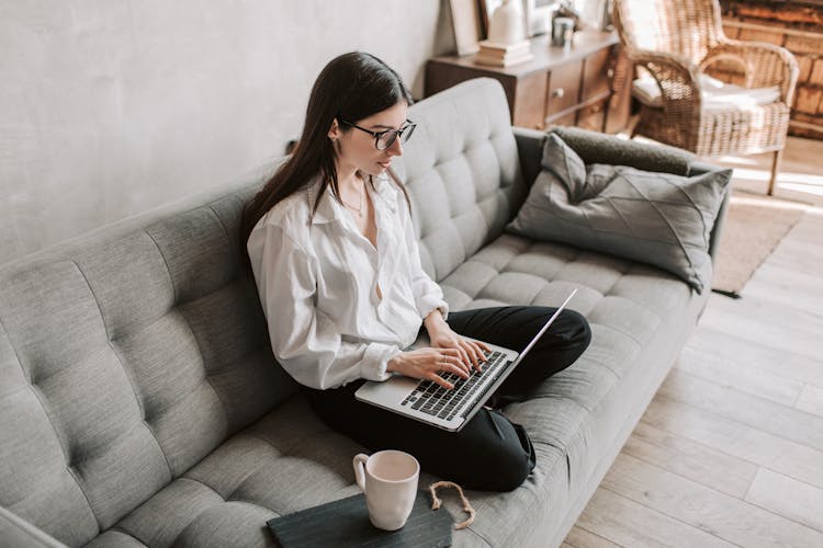 Woman Working At Home Using Laptop