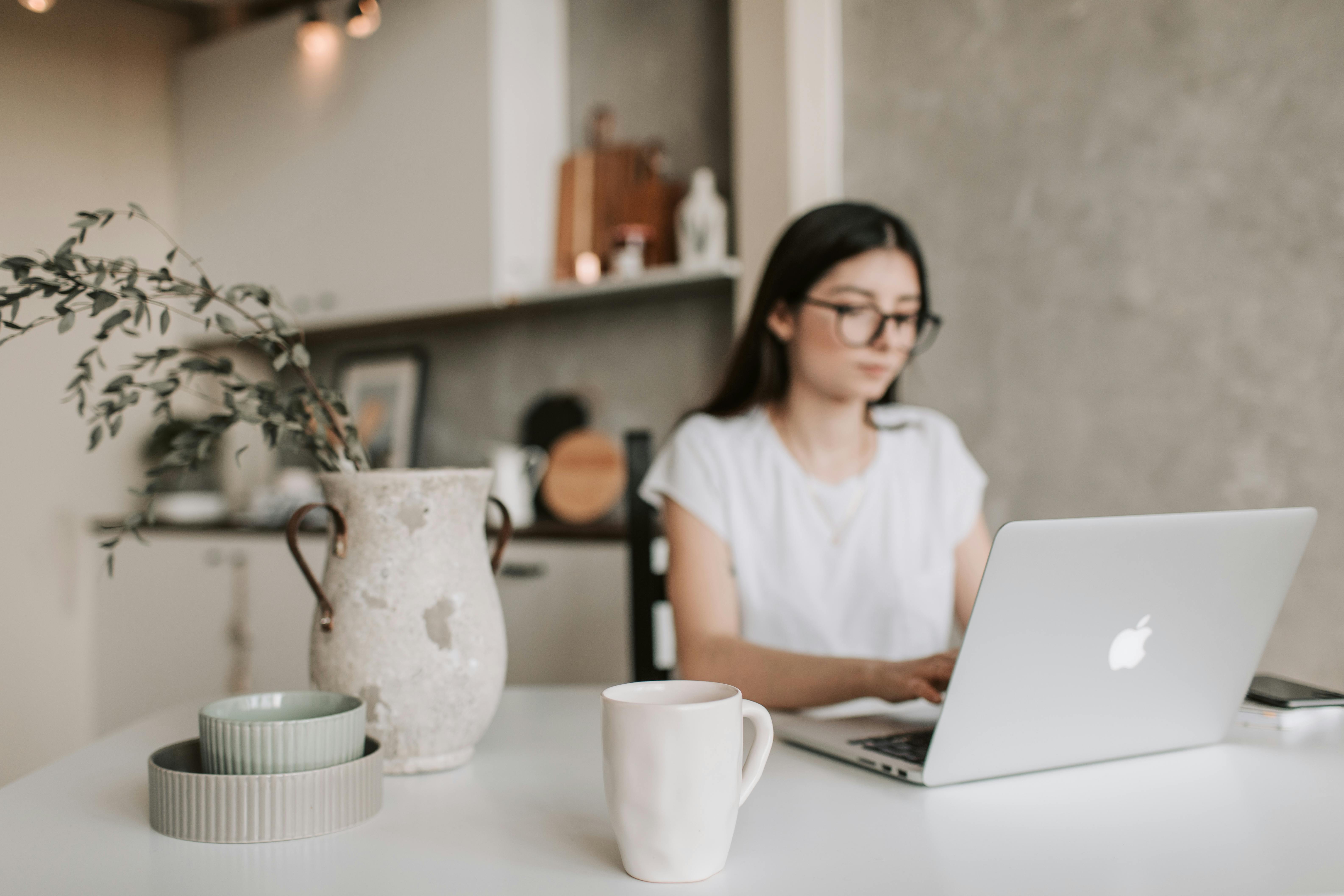 focused young businesswoman working remotely at home