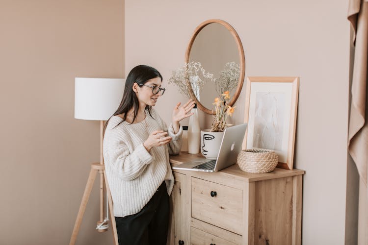 Young Woman Talking Via Laptop At Home