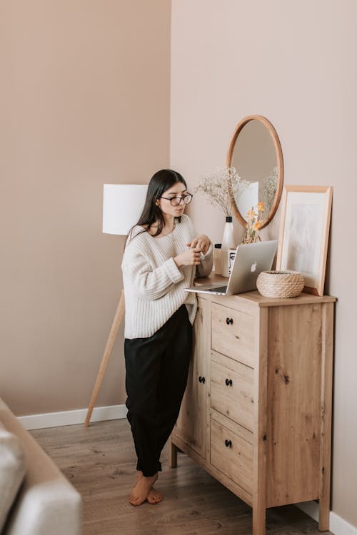Young lady using laptop at home