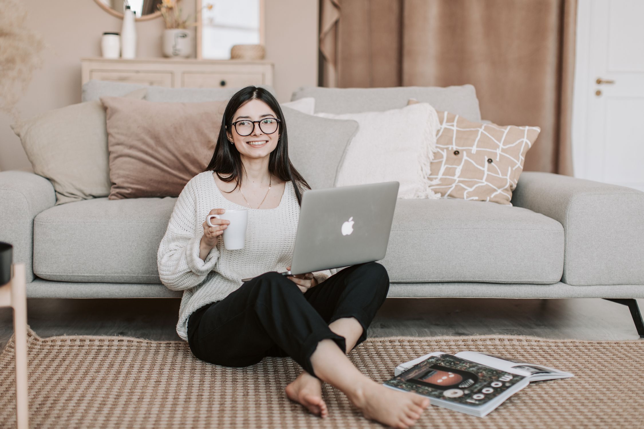 Cheerful woman using laptop at home · Free Stock Photo