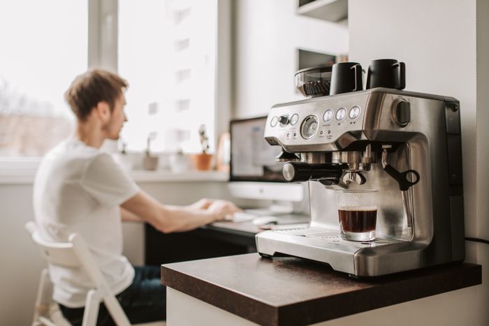 Espresso machine on a counter in a workspace — photo by Vlada Karpovich on Pexels