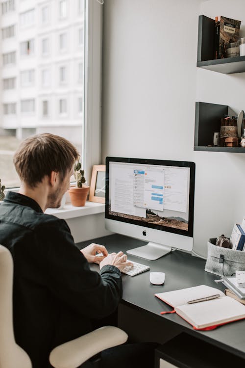 Photo Of Man Using Computer