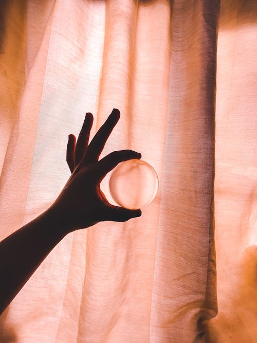 Free Photo Of Person Holding Crystal Ball Stock Photo