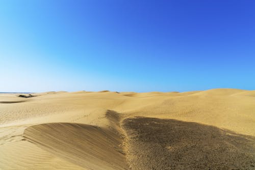 Free Photo Of Desert Under Blue Sky Stock Photo